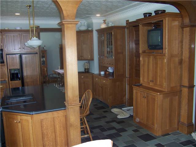 Quartersawn white oak cabinets - Flat panel doors and end panels - Inset style - Corian solid surface countertops